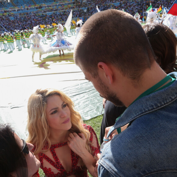 La chanteuse Shakira, son compagnon Gerard Piqué et leur fils Milan lors de la finale de la coupe du monde Allemagne-Argentine à Rio de Janeiro, le 13 juillet 2014.