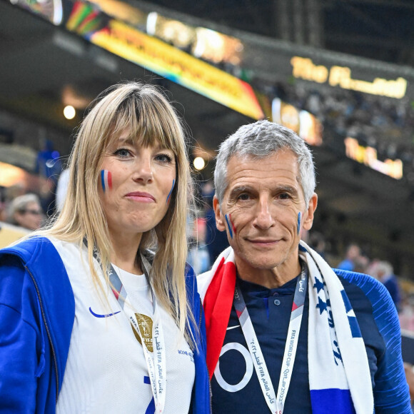Nagui et sa femme Mélanie Page dans les tribunes du match "France - Argentine (3-3 - tab 2-4)" en finale de la Coupe du Monde 2022 au Qatar, le 18 décembre 2022. © Philippe Perusseau / Bestimage  Celebrities in the stands during the final match "France - Argentina (3-3 - tab 2-4)" of the 2022 World Cup in Qatar (FIFA World Cup Qatar 2022). December 18th, 2022. 