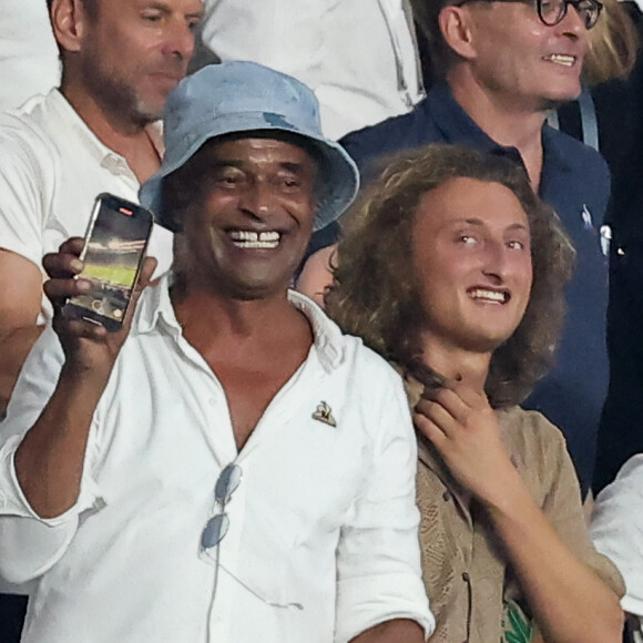 Yannick Noah et son fils Joalukas - People dans les tribunes lord du match d'ouverture de la Coupe du Monde de Rugby France 2023 avant le match de la Poule A entre la France et la Nouvelle-Zélande au Stade de France à Saint-Denis le 8 septembre 2023. © Dominique Jacovides/Bestimage 