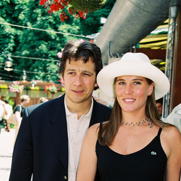Laurent Gerra et Mathilde Seigner - Tournoi de tennis Roland Garros en 1999 à Paris.