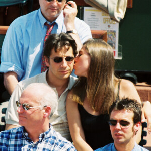 Laurent Gerra et Mathilde Seigner - Tournoi de tennis Roland Garros en 1999 à Paris.