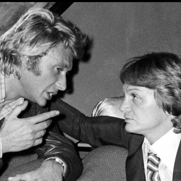 ARCHIVES - Johnny Hallyday et Claude François lors d'une soirée à Paris en 1976 