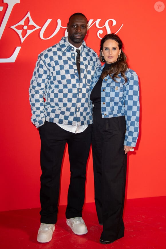 Omar Sy et Helene Sy assistent au défilé Louis Vuitton Menswear Fall/Winter 2024-2025 dans le cadre de la semaine de la mode à Paris, en France, le 16 janvier 2024. Photo par Aurore Marechal/ABACAPRESS.COM