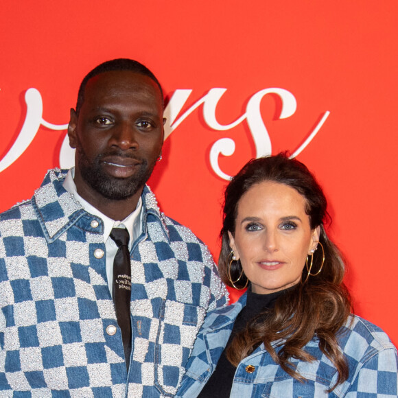 Omar Sy et Helene Sy assistent au défilé Louis Vuitton Menswear Fall/Winter 2024-2025 dans le cadre de la semaine de la mode à Paris, en France, le 16 janvier 2024. Photo par Aurore Marechal/ABACAPRESS.COM