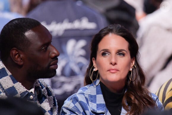 Omar Sy et Hélène Sy, son épouse, au premier rang du défilé Louis Vuitton Menswear Fall/Winter 2024-2025 dans le cadre de la Semaine de la mode de Paris, le 16 janvier 2024 à Paris, en France. Photo par Jana Call me J/ABACAPRESS.COM