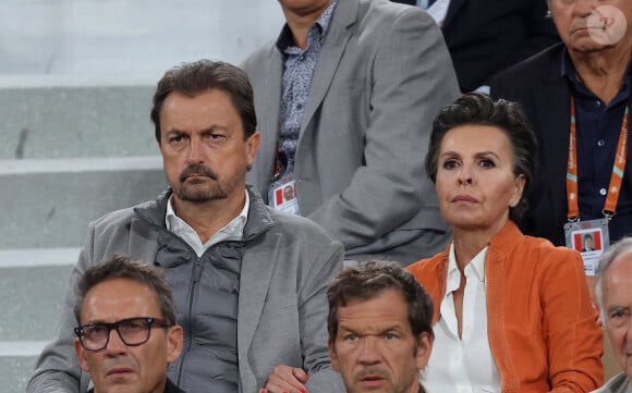 Henri Leconte et sa compagne Maria Dowlatshahi, Julien Courbet - Célébrités dans les tribunes des Internationaux de France de tennis de Roland Garros 2024 à Paris le 27 mai 2024. © Moreau-Jacovides/Bestimage