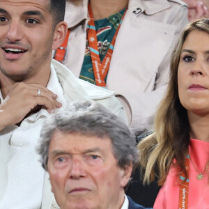 Marion Bartoli et son mari Yahya Boumediene - Célébrités dans les tribunes des Internationaux de France de tennis de Roland Garros 2024 à Paris le 27 mai 2024. © Moreau-Jacovides/Bestimage