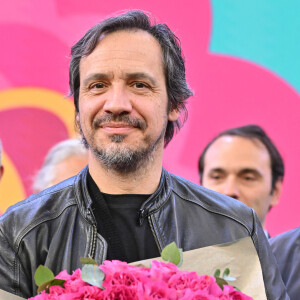 Alexandre Astier baptise une rose à son nom lors de l'inauguration de la Foire de Lyon à Lyon, France, le 31 mars 2023. Photo par Julien Reynaud/APS-Medias/ABACAPRESS.COM