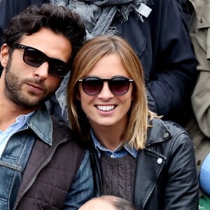 Maxim Nucci (Yodelice) et sa compagne Isabelle Ithurburu dans les tribunes des Internationaux de France de tennis de Roland Garros à Paris. Le 24 mai 2016 © Dominique Jacovides / Bestimage