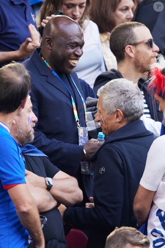 Wilfrid Mbappé, Nagui - Célébrités dans les tribunes du match du groupe D de l'Euro 2024 entre l'équipe de France face à l'Autriche (1-0) à Dusseldorf en Allemagne le 17 juin 2024. © Cyril Moreau/Bestimage