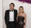 Margot Robbie et Tom Ackerley vivent une belle histoire d'amour depuis leur rencontre sur le film Suite Française il y a plus de dix ans
Tom Ackerley et Margot Robbie à la 96ème cérémonie des Oscars au Dolby Theater à Hollywood