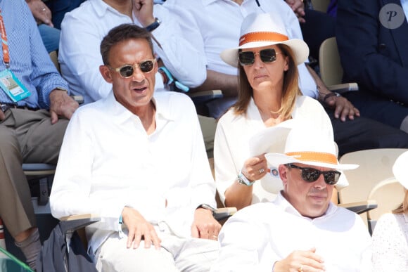 Julien Courbet et sa femme Catherine en tribunes lors des Internationaux de France de tennis de Roland Garros 2023, à Paris, France, le 6 juin 2023. © Jacovides-Moreau/Bestimage