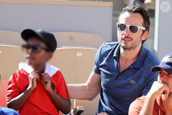 Michaël Cohen et son fils Surifel dans les tribunes lors des internationaux de tennis de Roland Garros à Paris, France, le 1er juin 2019. © Jacovides-Moreau/Bestimage 