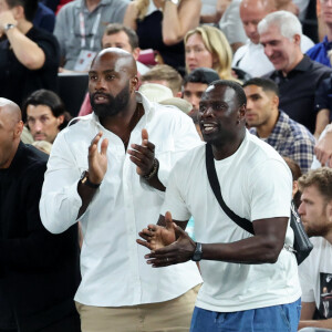 Léon Marchand, Thierry Henry, Teddy Riner, Omar Sy, Antoine Dupont - Les célébrités en tribunes pendant la finale de basketball opposant les Etats-Unis à la France (98-87) lors des Jeux Olympiques de Paris 2024 (JO) à l'Arena Bercy, à Paris, France, le 10 août 2024. © Jacovides-Perusseau/Bestimage 