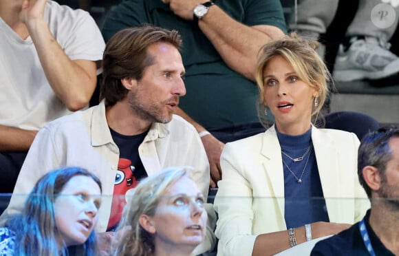 Ophélie Meunier et son mari Mathieu Vergne - Les célébrités en tribunes pendant l'épreuve de basketball de Demi-Finale opposant la France à l'Allemagne lors des Jeux Olympiques de Paris 2024 (JO) à l'Arena Bercy, à Paris, France. © Jacovides-Perusseau/Bestimage