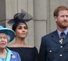 C'est en mars 2021 que la famille royale a découvert avec effroi les accusations du couple. 
La reine Elisabeth II d'Angleterre, Meghan Markle, duchesse de Sussex (habillée en Dior Haute Couture par Maria Grazia Chiuri), le prince Harry, duc de Sussex - La famille royale d'Angleterre lors de la parade aérienne de la RAF pour le centième anniversaire au palais de Buckingham à Londres. Le 10 juillet 2018