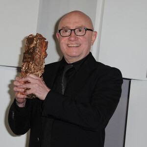 Michel Blanc pose lors du photocall de la 37e cérémonie des César du cinéma qui s'est tenue au Théâtre du Chatelet à Paris, France, le 24 février 2012.