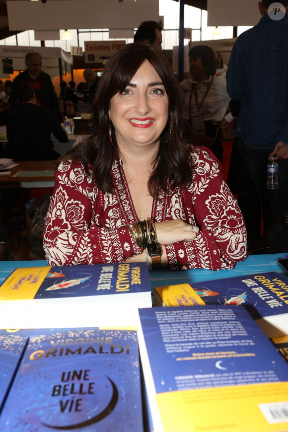 Dont elle ne s'est jamais vraiment remise 
Virginie Grimaldi lors de la Foire du Livre de Brive dans La Halle Brassens, à Brive-la-Gaillarde, France. © Jean-Marc-Lhomer/Bestimage