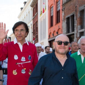 Michel Blanc assiste à la ducasse de Mons ou Doudou accompagné par Elio Di Rupo, Maire ( Bourgmestre ) de la ville de Mons et Président du Parti socialiste belge. Belgique, Mons, 11 juin 2017.