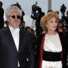 Pedro Almodovar et Maria Luisa Parades sur le tapis rouge du Festival de Cannes, avant la projection de You Will Meet A Tall Dark Stranger, de Woody Allen, le 15 mai 2010