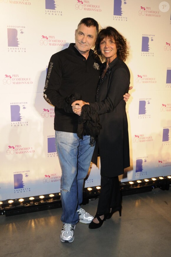 L'humoriste Jean-Marie Bigard et Stéphanie Fugain assistent au dîner de gala du 90e Prix  d'Amérique, au Cent-Quatre (Paris XIe), samedi 29 janvier 2011.