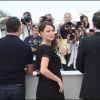 Bérénice Bejo présente The Artist, le 15 mai 2011, au festival de Cannes. Elle est enceinte de 4 mois et entourée de son mari, le réalisateur Michel Hazanavicius et de Jean Dujardin !