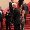 Jean-Paul Belmondo et Barbara Gandolfi lors de la projection du documentaire "Belmondo, itinéraire...", le 17 mai 2011, dans le cadre du 64e festival de Cannes.