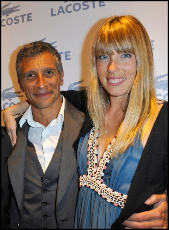 Nagui et sa femme Mélanie Page lors de l'inauguration de la nouvelle boutique Lacoste sur les Champs-Elysées en avril 2011
