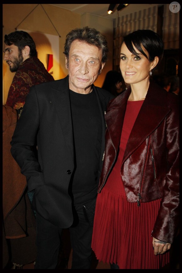 Johnny Hallyday et Laeticia lors de la soirée en l'honneur de Christian Louboutin à Paris à la galerie du passage. Le 21 novembre 2011