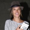 Alessandra Ambrosio a le sourire à l'aéroport de Los Angeles, accompagnée par sa petite famille. Le 3 février 2012.