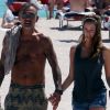 Christian Audigier et sa belle Nathalie Sorensen sortent de la plage à Miami le 24 mars 2012