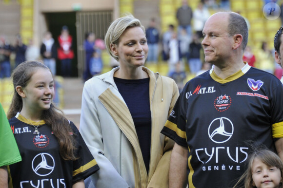 Albert de Monaco, la princesse Charlène et Michael Schumacher le 22 mai 2012 à Monaco pour un match de charité organisé au profit de l'association de la princesse Charlène