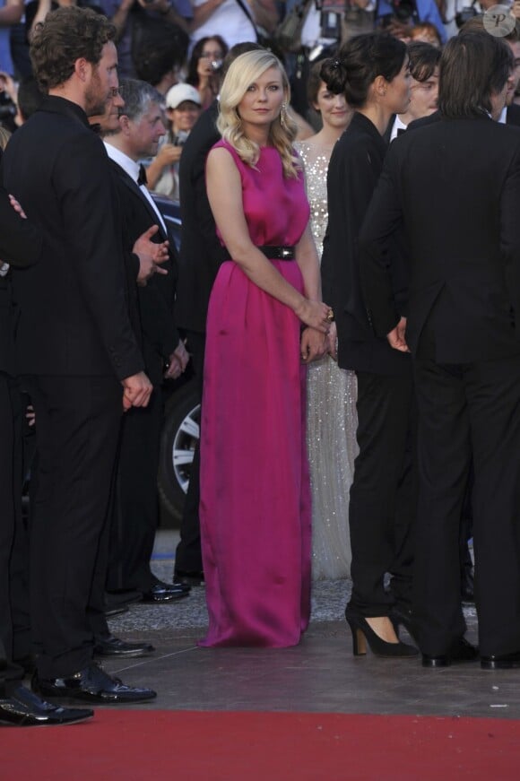 Kirsten Dunst en Christian Dior lors de la montée des marches de Sur la route, au Festival de Cannes le 23 mai 2012.