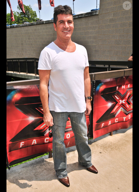 Simon Cowell, membre du jury de X Factor, arrive sur les auditions de X Factor, au Texas, le jeudi 24 mai 2012.