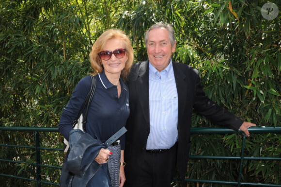Gérard Houllier et sa femme le 31 mai 2012 dans les travées de Roland-Garros à Paris