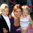  Poppy Montgomery a assisté à la projection de  Brave  avec son fils Jackson et une autre fillette. Los Angeles le 18 juin 2012 
  