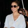 Jennifer Lopez tout sourire à la sortie du centre commercial Barney's New York à New York, le 23 juillet 2012.