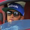 Lewis Hamilton heureux au volant de sa McLaren MP4-12C à Cannes avec Swizz Beatz le 24 juillet 2012