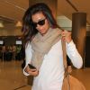 Triste, Eva Longoria arrive à l'aéroport de Miami le 3 août 2012 après avoir assisté à l'enterrement de son amie Lupe Ontiveros
