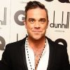 Robbie Williams, habillé en Farrell, recevait le trophée d'Icône de l'Année lors des GQ Men Of The Year Awards 2012 à la Royal Opera House. Londres, le 4 septembre 2012.