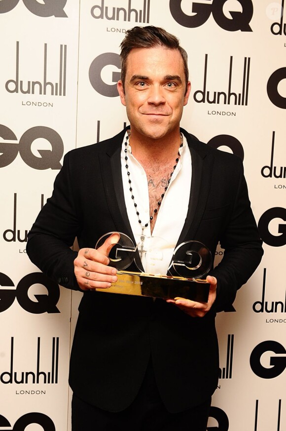Robbie Williams, habillé en Farrell, recevait le trophée d'Icône de l'Année lors des GQ Men Of The Year Awards 2012 à la Royal Opera House. Londres, le 4 septembre 2012.