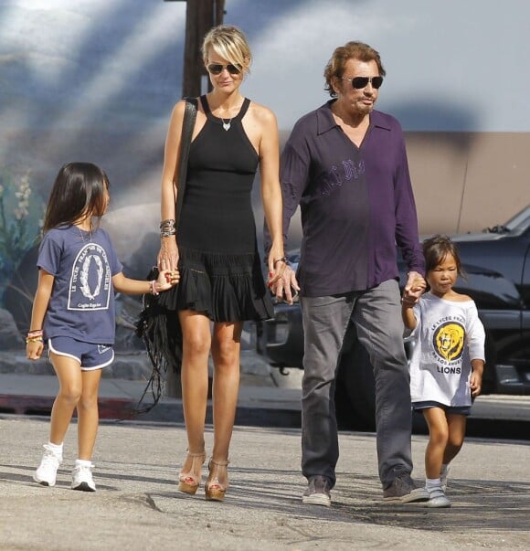 Johnny et Laetitia Hallyday, avec leurs filles Jade et Joy, le 10 septembre 2012 à Los Angeles.