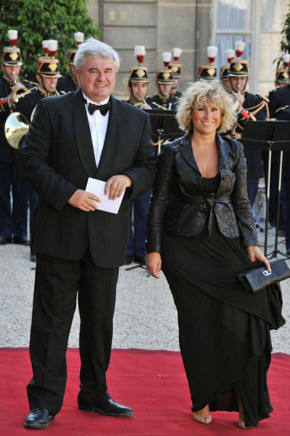 Eric Raoult et sa femme à L'Elysée, le 22 juin 2009.