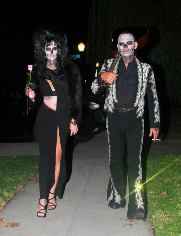 Christian Audigier et sa compagne Nathalie Sorensen se rendent à la soiree d'Halloween de Rihanna au Manoir Greystone à West Hollywood, le 31 octobre 2012.