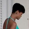 Rihanna, sexy dans son maillot de bain bleu turquoise, retrouve le calme dans sa maison à Bridgetown. Le 21 décembre 2012.