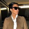 Kim Kardashian, stylée avec ses lunettes Céline et ses bottines Giuseppe Zanotti pour Balmain, se rend dans un hôpital avec son chéri Kanye West. Beverly Hills, le 22 décembre 2012.