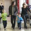 La belle Sharon Stone, son petit ami Martin Mica et ses fils Roan, Laird et Quinn à l'aéroport de Los Angeles, le 23 decembre 2012.