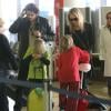 Sharon Stone, son petit ami Martin Mica et ses fils Roan, Laird et Quinn à l'aéroport de Los Angeles, le 23 decembre 2012.