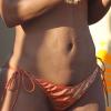 En bikini, la chanteuse Christina Milian fait la fête en bikini sur la plage de Cabo San Lucas au Mexique, le 16 mars 2013.
