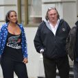 Gérard Depardieu, sa fille Roxane et Luc Besson dans les rues de New York le 13 avril 2013.
